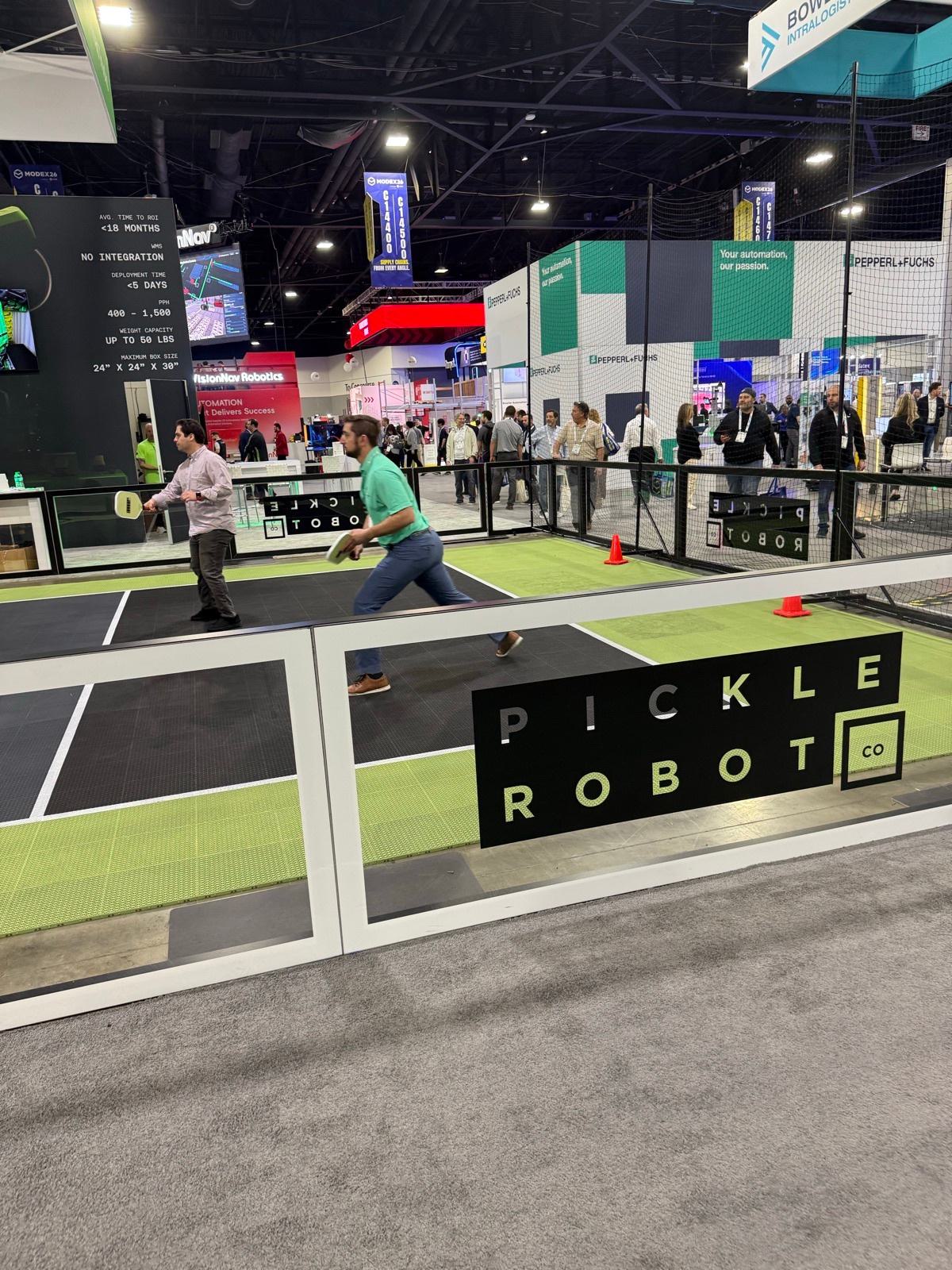 RHR team and Pickle Robot team on the pickleball court at Modex